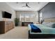 Main bedroom with large windows, dresser, and ceiling fan at 5725 S 101St St, Mesa, AZ 85212