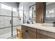 Spa-like bathroom with frameless shower, double vanity, and marble tile at 5725 S 101St St, Mesa, AZ 85212