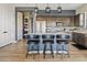 Modern kitchen with an island, stainless steel appliances, and stylish cabinetry at 5725 S 101St St, Mesa, AZ 85212