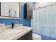 Modern bathroom with blue vanity and shower at 5725 S 101St St, Mesa, AZ 85212
