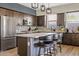 Modern kitchen with stainless steel appliances and an island with seating at 5725 S 101St St, Mesa, AZ 85212