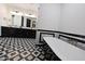 Bathroom with black and white tile and free standing tub at 31214 N 167Th Ave, Surprise, AZ 85387