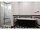 Modern bathroom with a free-standing tub and walk-in shower at 31214 N 167Th Ave, Surprise, AZ 85387