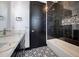 Contemporary bathroom with marble countertops and black accents at 31214 N 167Th Ave, Surprise, AZ 85387