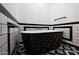Bathroom with black and white tile and a modern, free-standing bathtub at 31214 N 167Th Ave, Surprise, AZ 85387