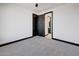 Bedroom with grey carpet and access to bathroom at 31214 N 167Th Ave, Surprise, AZ 85387