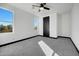 Bright bedroom featuring grey carpet and two windows at 31214 N 167Th Ave, Surprise, AZ 85387