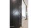 Black barn doors with gold handles at 31214 N 167Th Ave, Surprise, AZ 85387