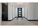 Bright entryway with black barn door and tile flooring at 31214 N 167Th Ave, Surprise, AZ 85387