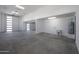 Large garage with high ceilings, concrete floor, and two garage doors at 31214 N 167Th Ave, Surprise, AZ 85387