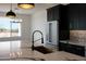 Modern kitchen island with gold sink and marble countertop at 31214 N 167Th Ave, Surprise, AZ 85387