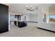 Modern kitchen with island, dark cabinets, and breakfast nook at 31214 N 167Th Ave, Surprise, AZ 85387