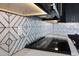 Close up of modern geometric backsplash and cooktop at 31214 N 167Th Ave, Surprise, AZ 85387