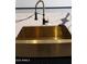 Modern gold farmhouse sink with black faucet at 31214 N 167Th Ave, Surprise, AZ 85387