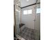 Walk in shower with black and white tile and built in seat at 31214 N 167Th Ave, Surprise, AZ 85387