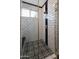 Walk in shower with black and white tile and built in seat at 31214 N 167Th Ave, Surprise, AZ 85387