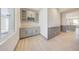 Modern butler's pantry with gray cabinets and wood countertops at 31224 N 167Th Ave, Surprise, AZ 85387