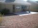 Covered patio with gravel yard and hanging swing at 5830 E Mckellips Rd # 62, Mesa, AZ 85215