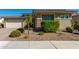 Single-story home with neutral color scheme and landscaped front yard at 28389 N 131St Dr, Peoria, AZ 85383