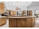 Large kitchen with a curved island, ample cabinetry, and granite countertops at 6620 E Stallion Rd, Paradise Valley, AZ 85253