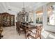 Elegant formal dining room featuring a large table, chandelier, and built-in hutch at 6620 E Stallion Rd, Paradise Valley, AZ 85253