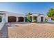 Three-car garage with brick driveway at 6620 E Stallion Rd, Paradise Valley, AZ 85253