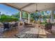 Relaxing backyard patio with seating and view of the lawn at 6620 E Stallion Rd, Paradise Valley, AZ 85253