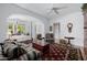Bright bedroom with sitting area, hardwood floors, and a four-poster bed at 6620 E Stallion Rd, Paradise Valley, AZ 85253