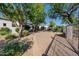 Inviting entryway with a wrought iron gate and a paved walkway at 6620 E Stallion Rd, Paradise Valley, AZ 85253
