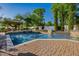 Inviting pool area with a spacious patio, gazebo, and waterfall features at 6620 E Stallion Rd, Paradise Valley, AZ 85253