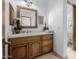 Bathroom with wooden vanity and view of toilet area at 6620 E Stallion Rd, Paradise Valley, AZ 85253