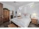 Bedroom with wooden furniture and access to bathroom at 6620 E Stallion Rd, Paradise Valley, AZ 85253