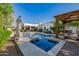 Stunning pool and spa area with a beautiful stone statue at 6620 E Stallion Rd, Paradise Valley, AZ 85253