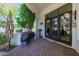 Outdoor kitchen area with grill and patio furniture at 6620 E Stallion Rd, Paradise Valley, AZ 85253