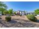 Stunning front yard with desert landscaping and a large white house at 6620 E Stallion Rd, Paradise Valley, AZ 85253
