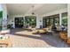 Large covered patio with comfortable seating and access to interior at 6620 E Stallion Rd, Paradise Valley, AZ 85253