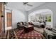 Bedroom with sitting area, hardwood floors, and a four-poster bed at 6620 E Stallion Rd, Paradise Valley, AZ 85253