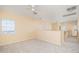 Spacious bedroom with ceiling fan and neutral carpeting at 21654 N 106Th Ln, Peoria, AZ 85382