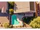 House with solar panels, pool, and backyard, aerial view at 1542 E Chaparral Pl, Casa Grande, AZ 85122