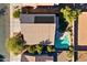 House with solar panels and a swimming pool, aerial view at 1542 E Chaparral Pl, Casa Grande, AZ 85122