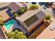 House with solar panels and a swimming pool, aerial view at 1542 E Chaparral Pl, Casa Grande, AZ 85122