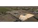 Aerial view of Lot 5, a 1-acre lot with a new home under construction at 18058 W Amber Dr, Goodyear, AZ 85338