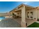 Backyard with patio cover, pool, and seating area at 11836 W Roanoke Ave, Avondale, AZ 85392