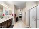 Double vanity bathroom with a large shower and walk-in closet at 21048 W Coronado Rd, Buckeye, AZ 85396