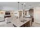 Modern kitchen with an island and views into the living room and backyard at 21048 W Coronado Rd, Buckeye, AZ 85396