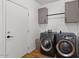 Laundry room with washer, dryer, and built-in cabinets at 1264 E Walnut Rd, Gilbert, AZ 85298