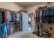 Spacious walk-in closet with double hanging rods and shoe storage at 1542 E Chaparral Pl, Casa Grande, AZ 85122