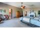 Large bedroom with ensuite bathroom access and a ceiling fan at 1542 E Chaparral Pl, Casa Grande, AZ 85122