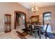 Formal dining room with a wood table and access to the kitchen at 1542 E Chaparral Pl, Casa Grande, AZ 85122
