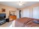 Bright bedroom featuring a large closet and dresser at 1542 E Chaparral Pl, Casa Grande, AZ 85122